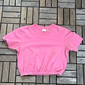 Pink crop top with elastic waistband.